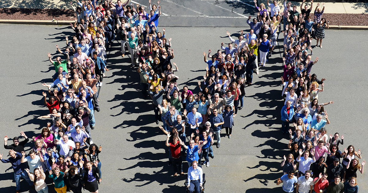 Mathematica staff in Princeton standing in the shape of an M