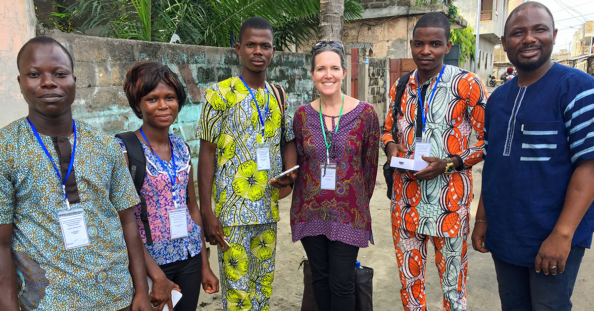 Sarah, (pictured third to the left), works with researchers in Benin to help the Benin government and the Millennium Challenge Corporation understand the impact of improved electricity on businesses and households.