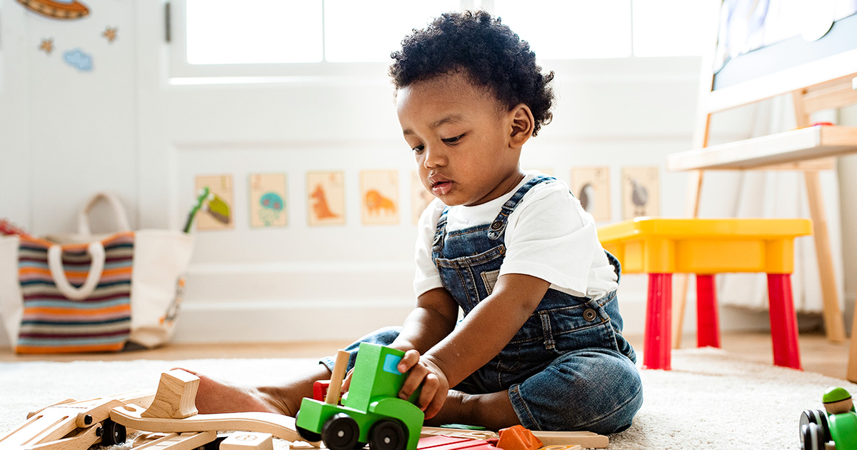 Toddler playing with toys