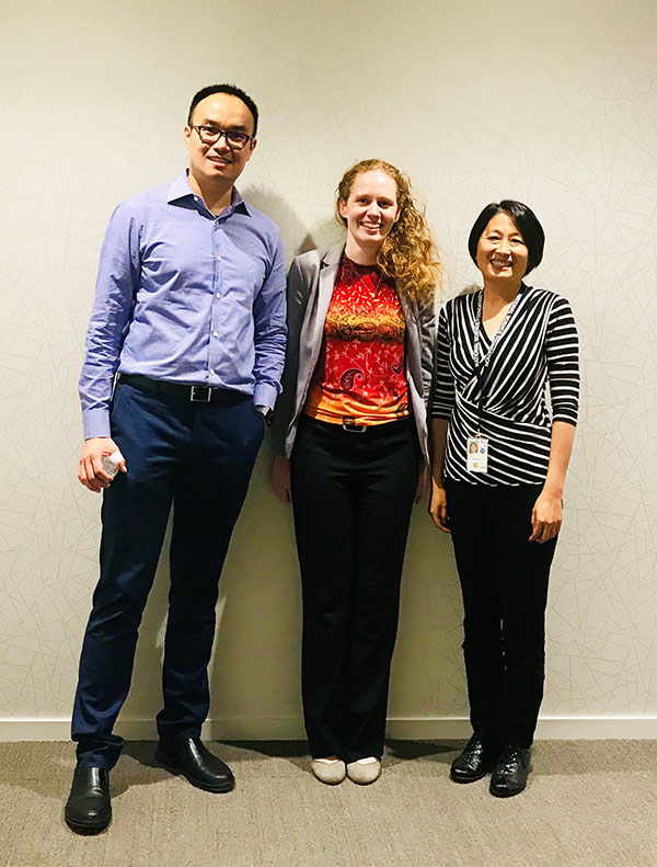 Fei Xing (left) presented the auto-coding algorithm and results to the client from the National Center for Science and Engineering Statistics at the National Science Foundation headquarters