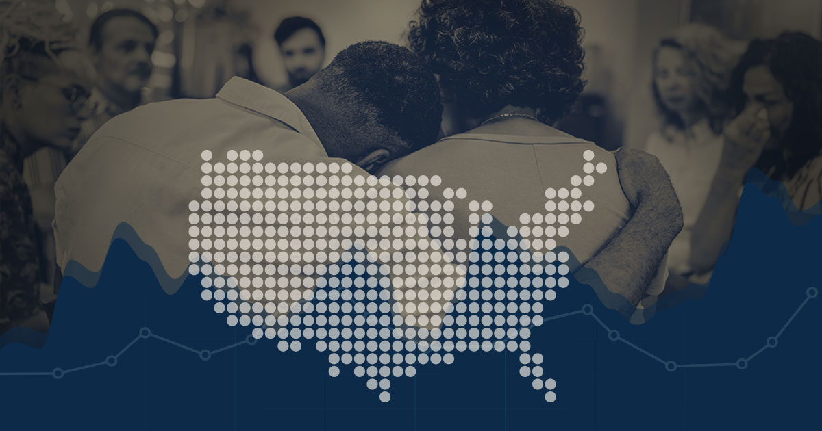 Illustration of a US map over a graph over an image of two people embracing surrounded by other people.