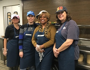 Staff volunteering at Miriam's kitchen