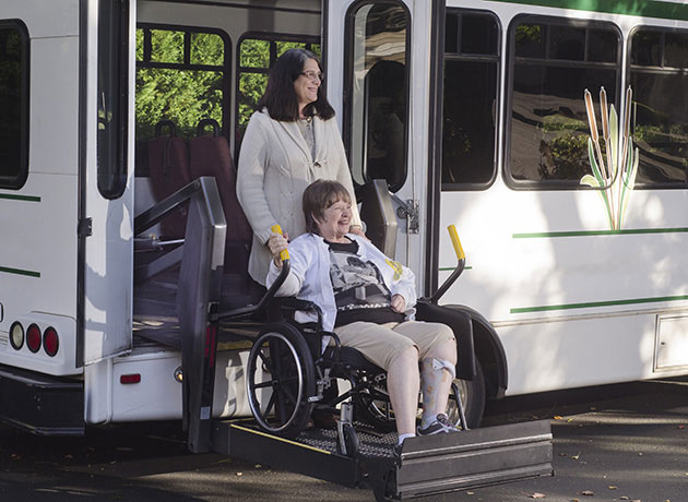 woman in a wheelchair using a chair lift