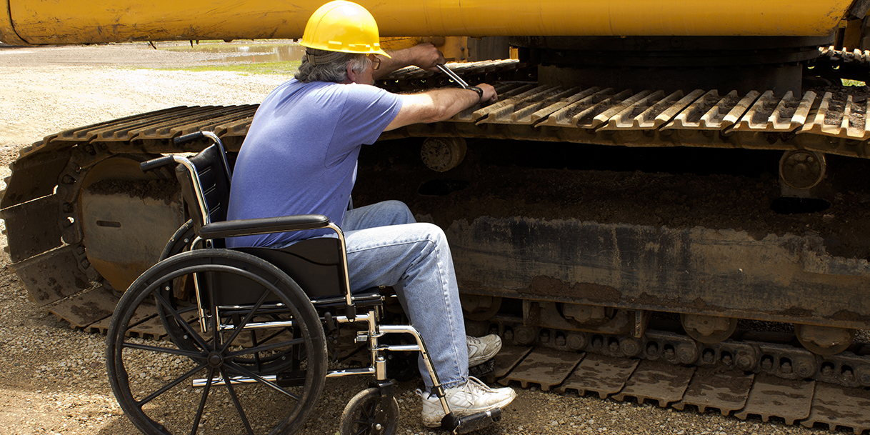 worker wearing hard hat in wheelchair worker wearing hard hat in wheelchair