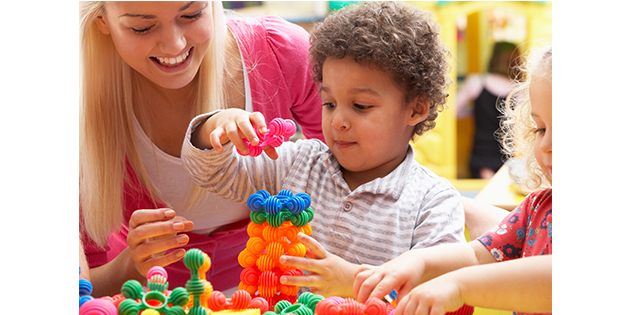 woman playing with young boy woman playing with young boy