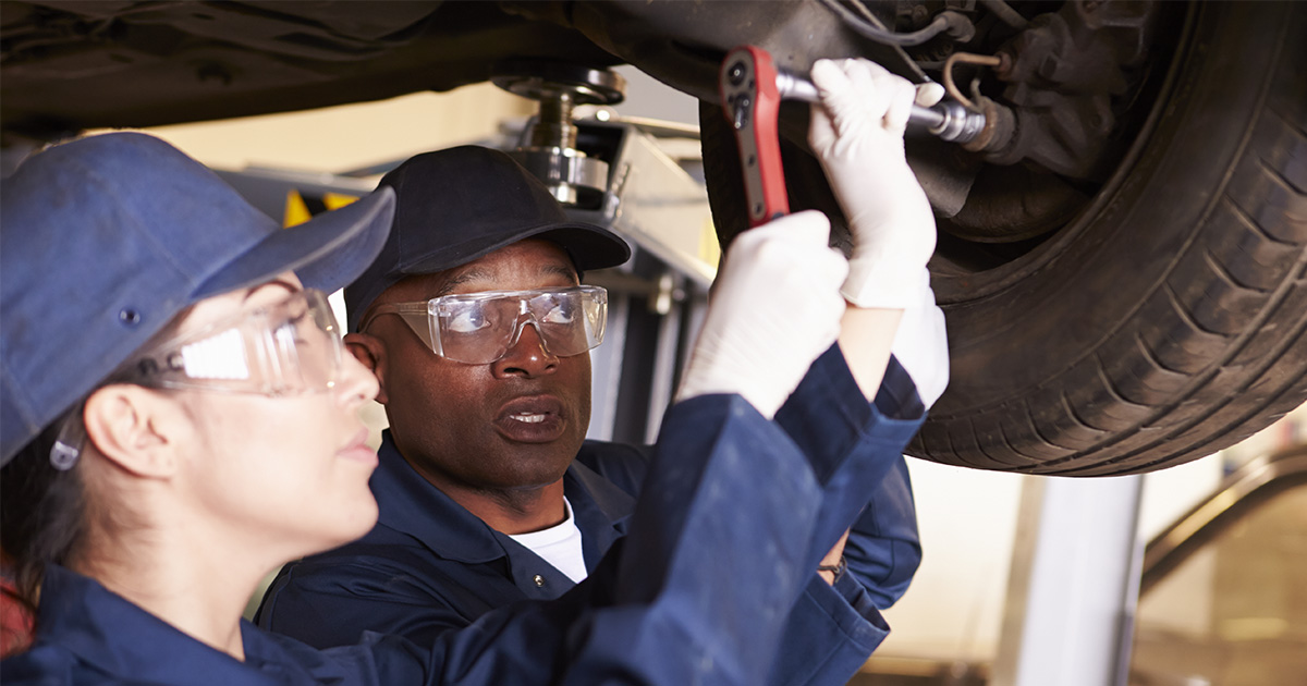 Students working on a car