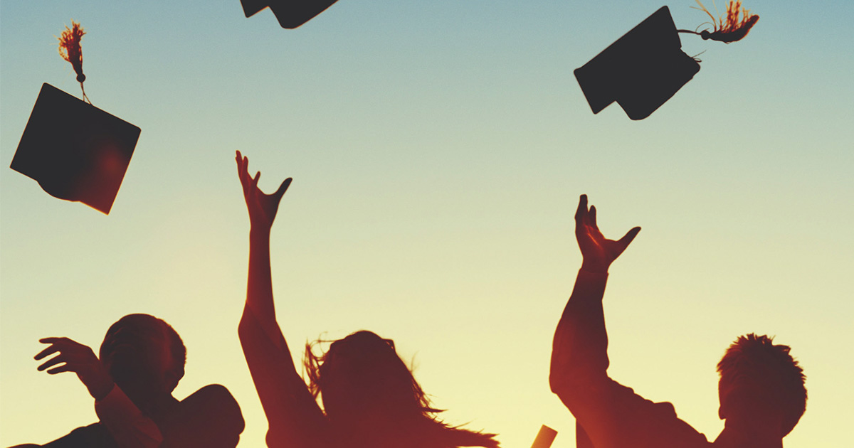 Students throwing caps after graduation