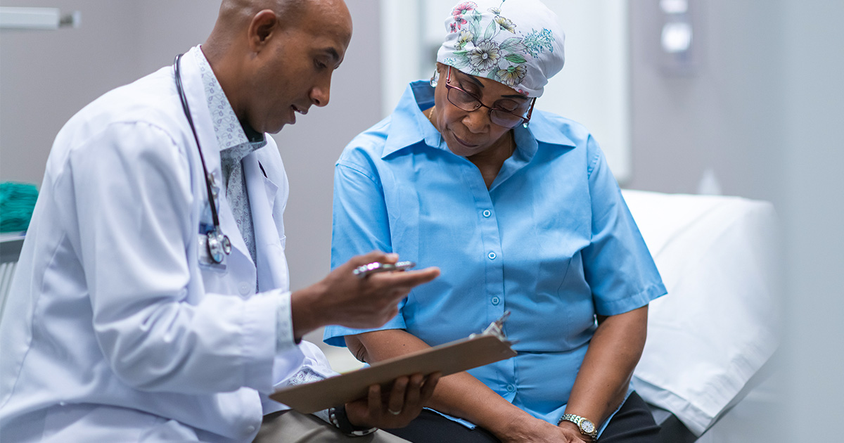 Doctor talking with patient