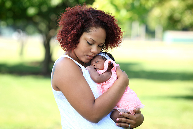teen mom holding infant teen mom holding infant