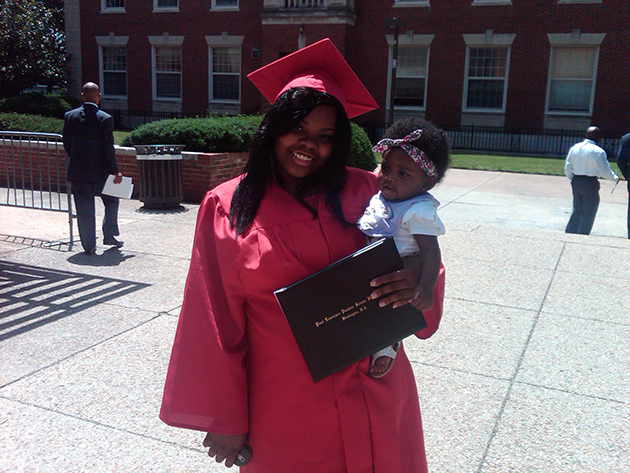 teen mother with infant at high school graduation