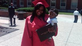 teen mother with infant at high school graduation