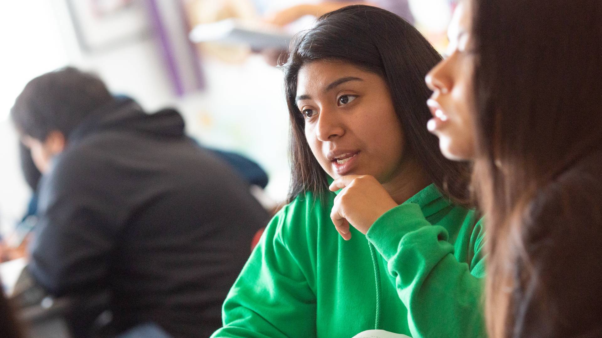 Two middle school girls in class