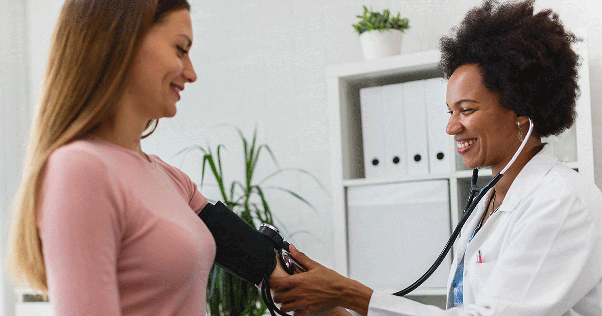 Doctor taking blood pressure