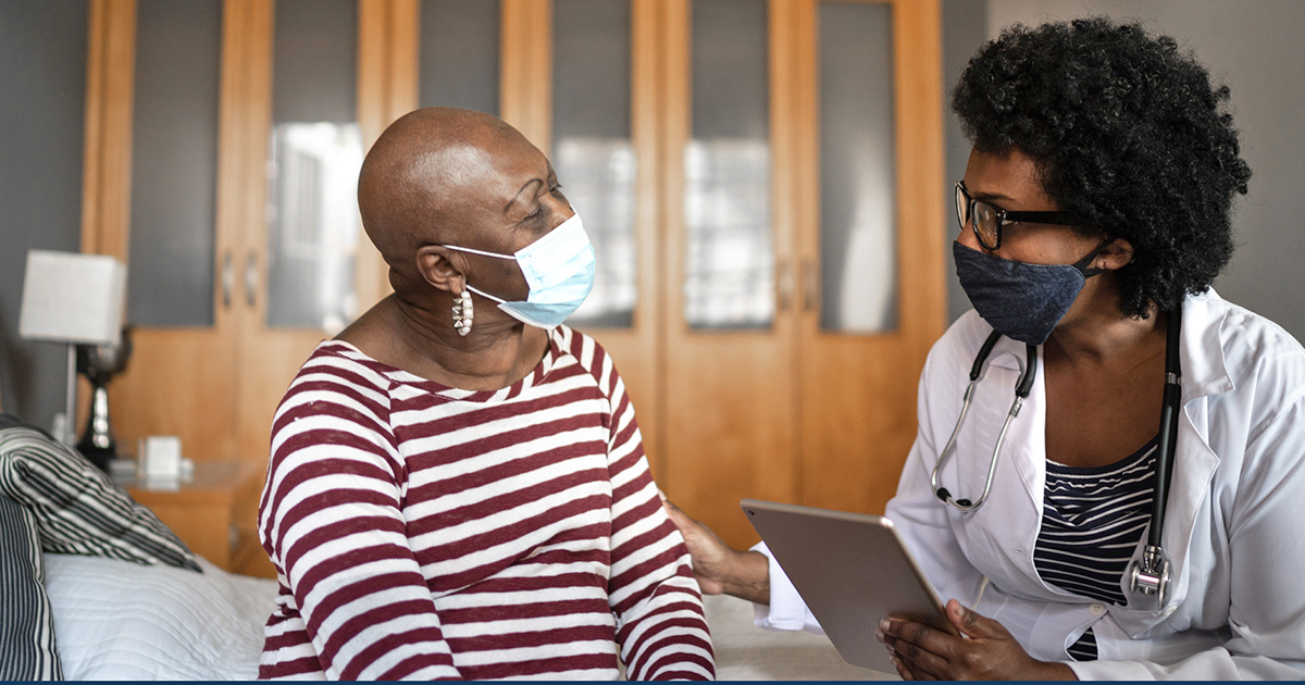 Health visitor and a senior woman during nursing home visit