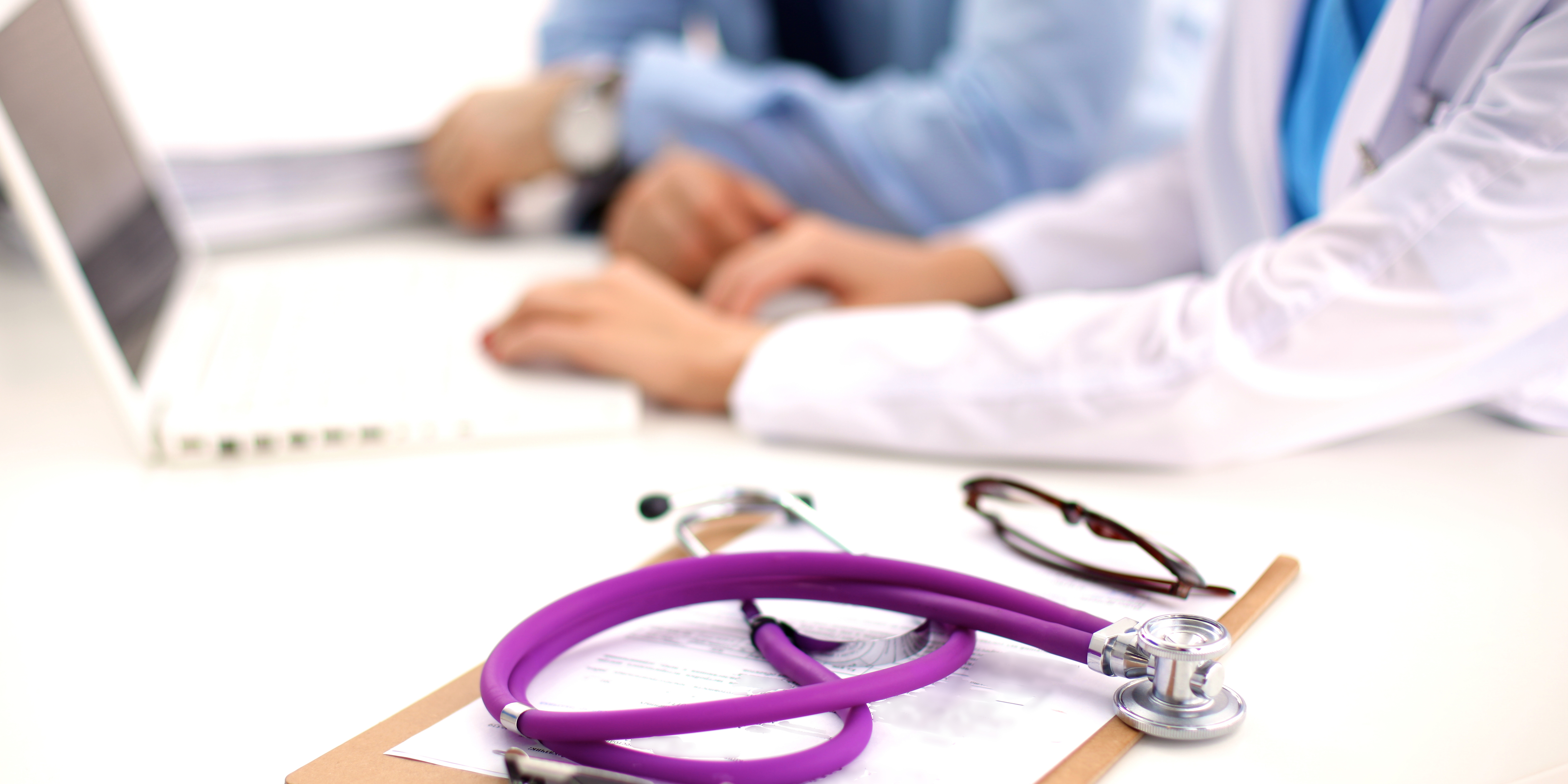 stethoscope with computer in background