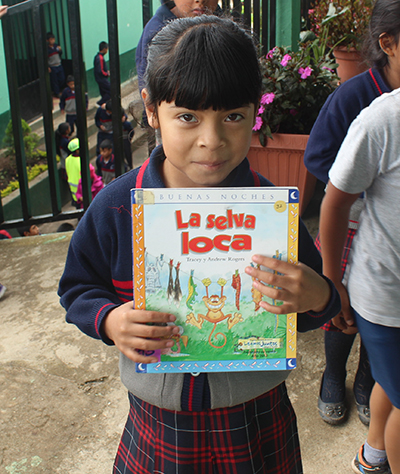 School girl holding a book