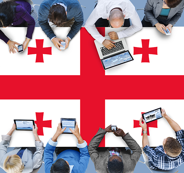 Republic of Georgia flag with people working on computers Republic of Georgia flag with people working on computers