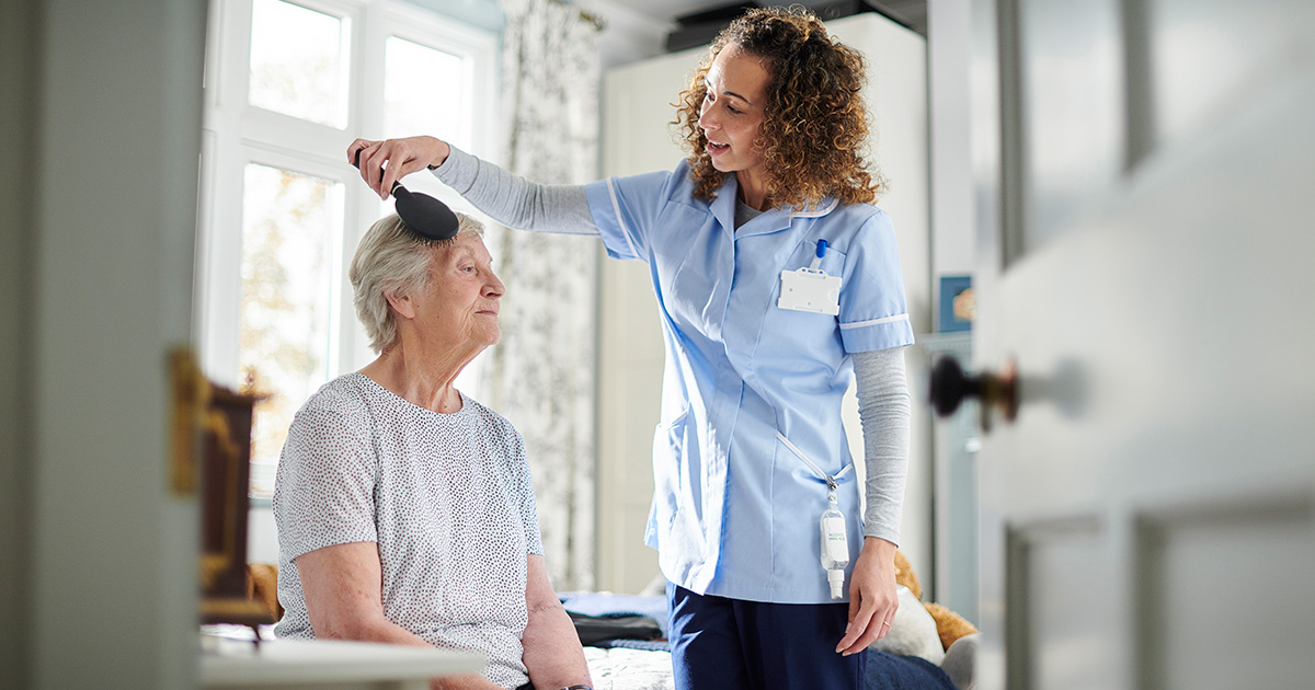 Caregiver assisting patient