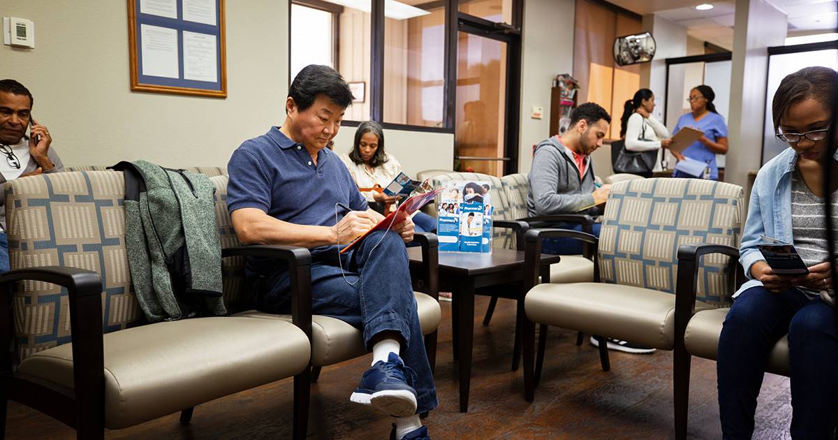 People waiting in a doctors office waiting room