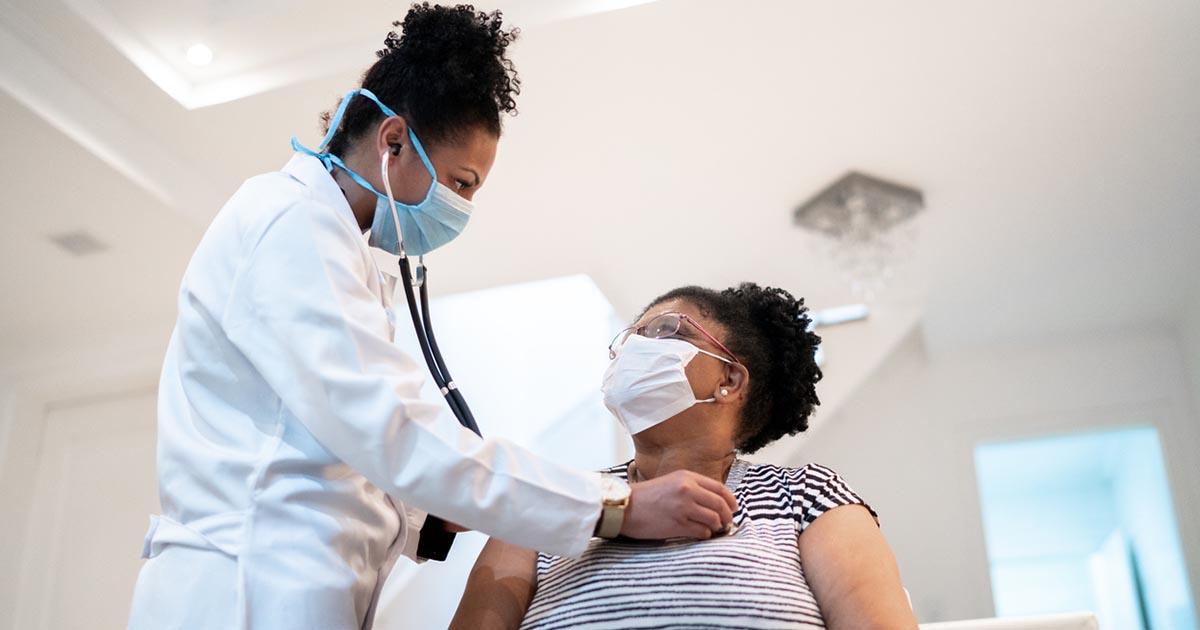 Doctor listening to a patients heart