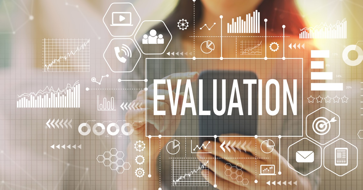 A person using a digital tablet is surrounded by semi-transparent data visualizations and icons representing analytics, charts, and gears. The word “EVALUATION” is prominently displayed in bold across the center.