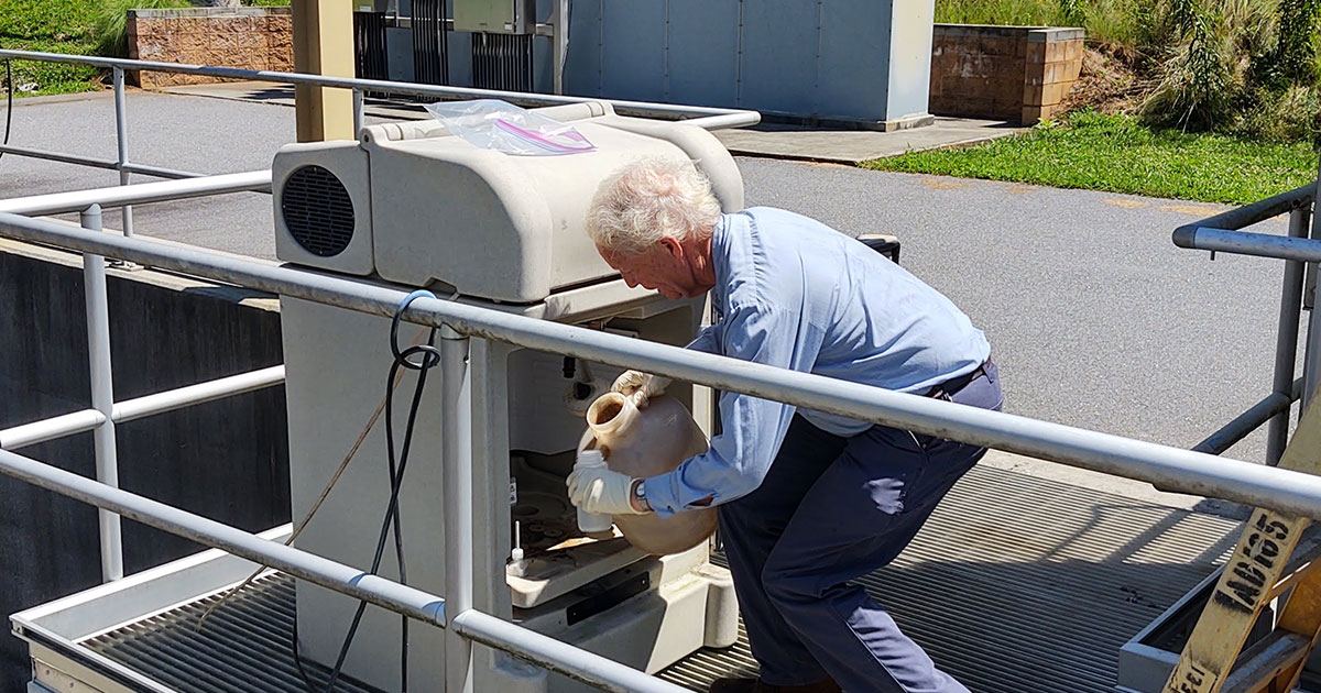 A wastewater operator collects samples for testing. Photo courtesy of the Tuckaseigee Water and Sewer Authority.