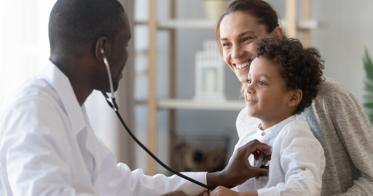 African male pediatrician hold stethoscope exam child boy patient visit doctor with mother, black pediatrician check heart lungs of kid do pediatric checkup in hospital children medical care concept