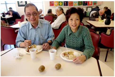 Elderly couple eating