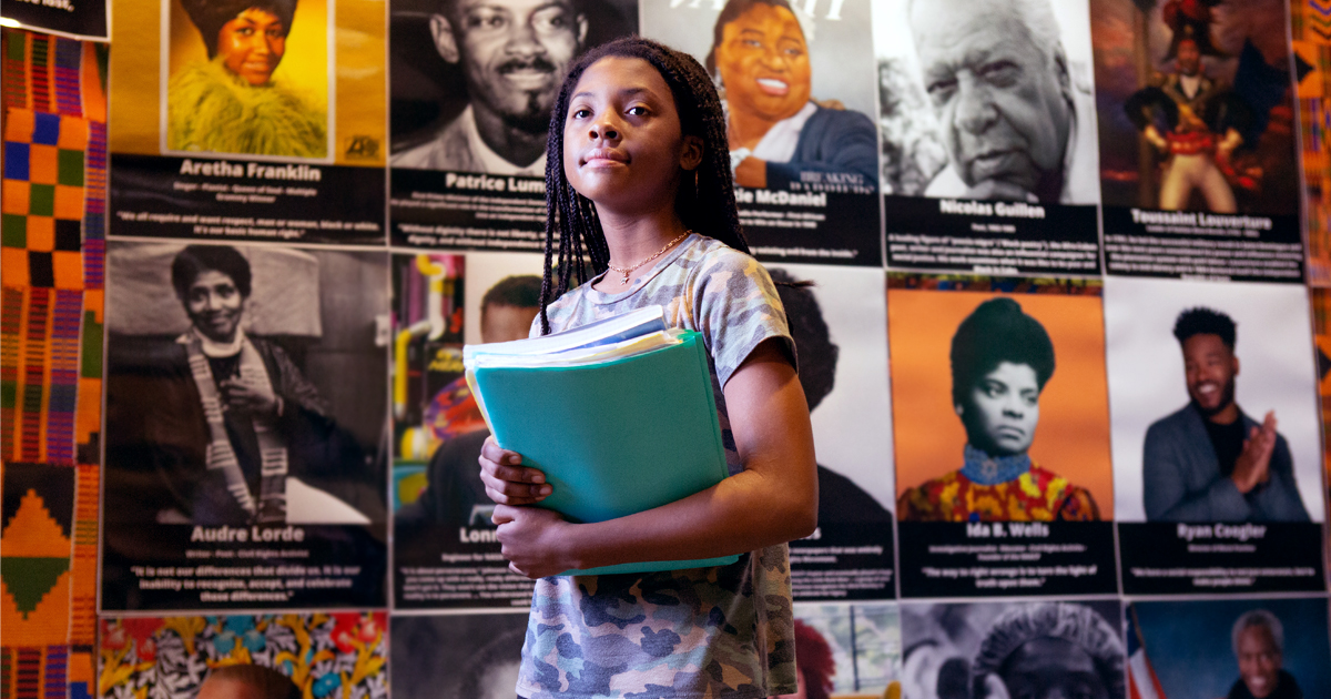 Teenage girl holding books