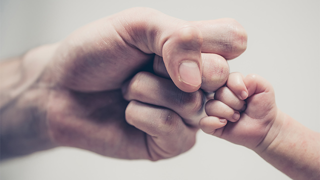 Father and son doing hand bump