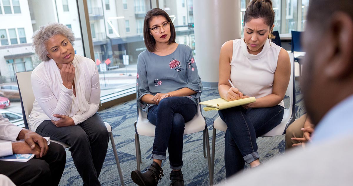 A group of people meeting in an office.