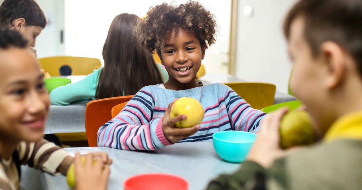 a child holding an apple