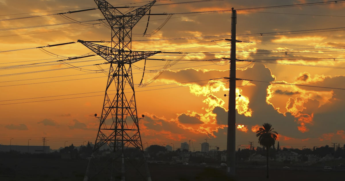 High voltage electricity pillars on the sunset background