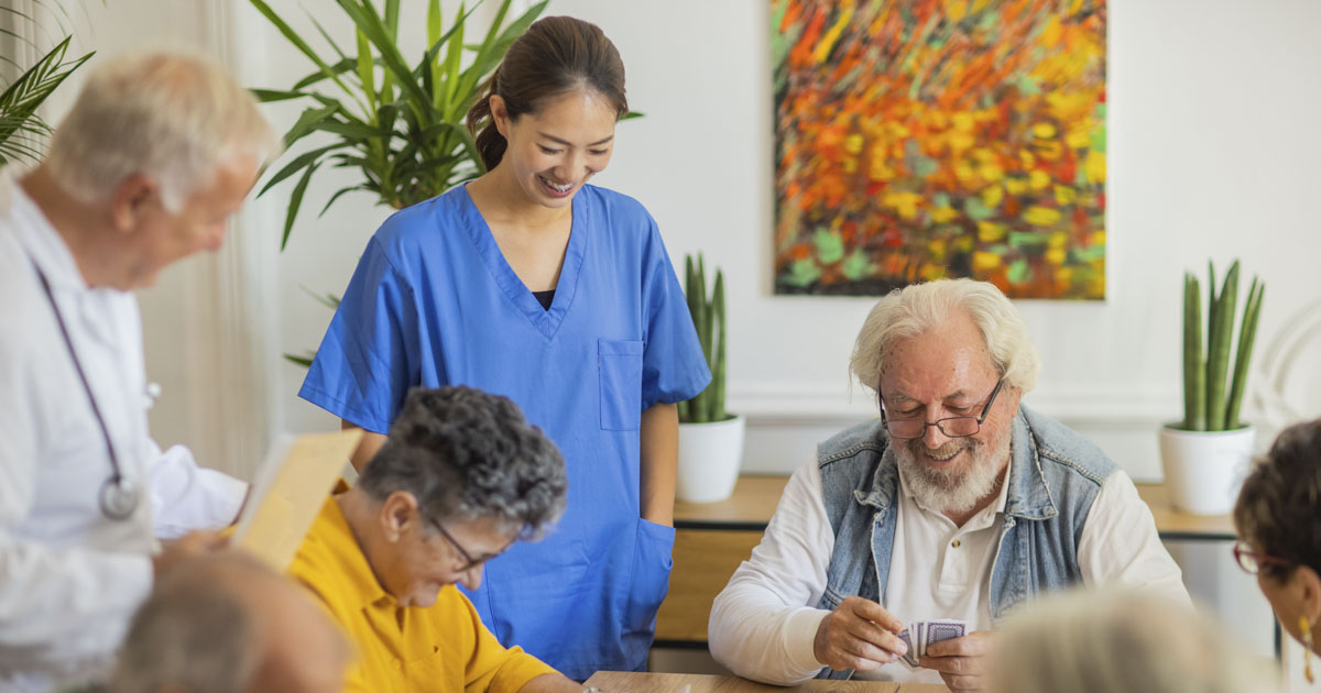 A couple plays cards in a medical facility.